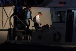 New York Mayor Eric Adams, right, disembarks a masted Mexican Navy training ship after boarding it with a New York Police Harbor Unit
